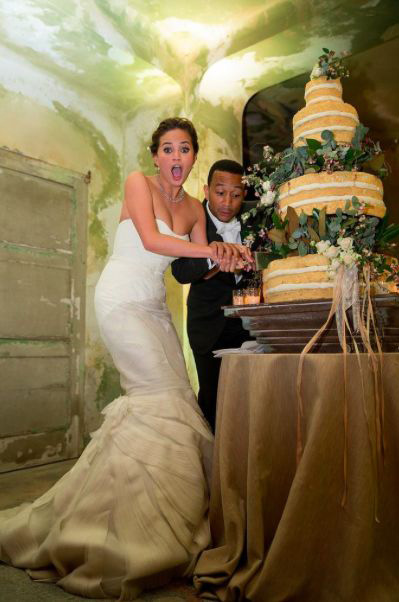 Bride and groom cut the wedding cake